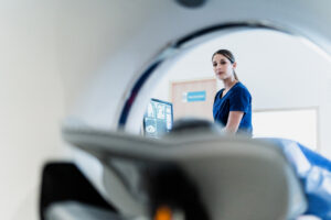 MRI technologist scanning patient