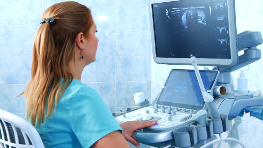 Healthcare worker analyzing ultrasound tests